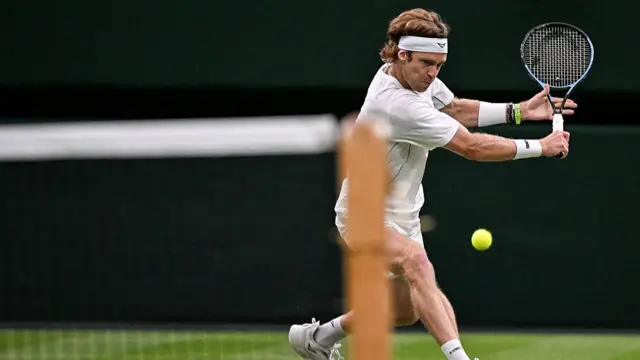 Andrey Rublev plays a backhand return