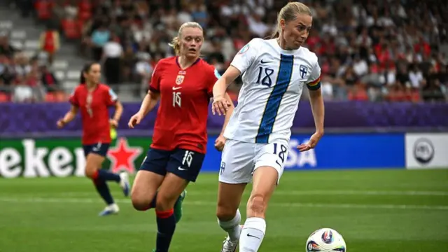 Norway's defender #16 Mathilde Harviken and Finland's forward #18 Linda Sallstrom fight for the ball during the UEFA Women's Euro 2025 Group A football match between Norway and Finland at the Stade de Tourbillon in Sion,