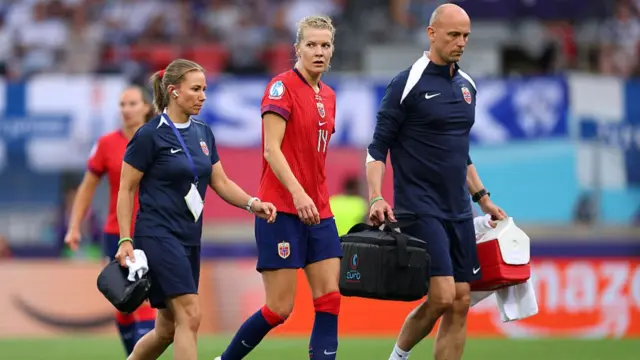Ada Hegerberg of Norway receives medical treatment during the UEFA Women's EURO 2025 Group A match between Norway and Finland at Stade de Tourbillon