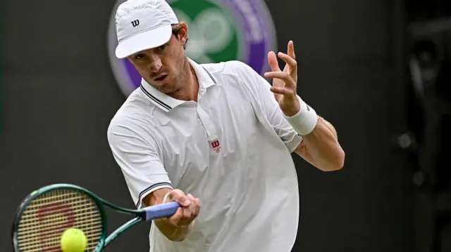 Nicolas Jarry plays a forehand return