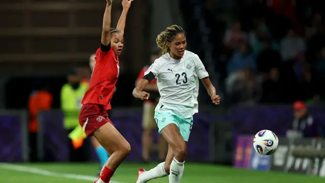 Iman Beney of Switzerland reacts, as Sveindis Jane Jonsdottir of Iceland runs towards a loose ball during the UEFA Women's EURO 2025 Group A match between Switzerland and Iceland at Stadion Wankdorf