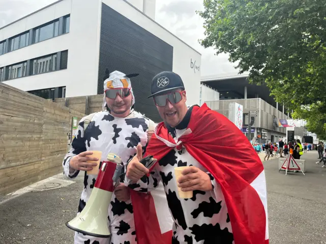 Switzerland fans dressed in cow costumes