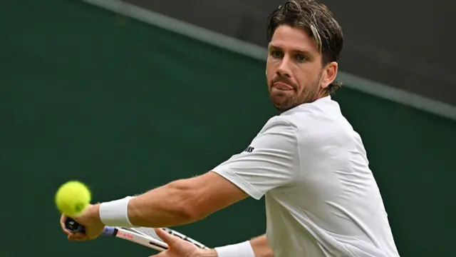 Cameron Norrie plays a backhand