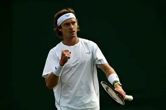 Andrey Rublev holds up his fist to celebrate