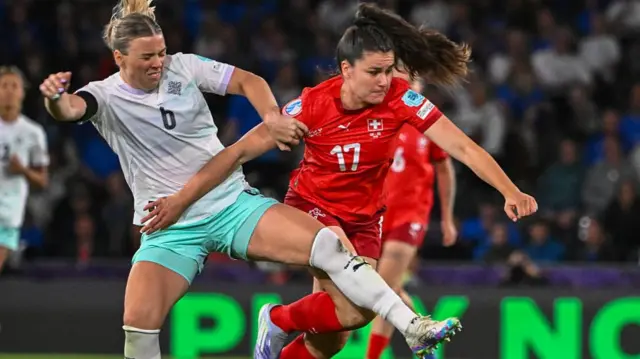 Iceland's defender #06 Ingibjorg Sigurdardottir and Switzerland's forward #17 Svenja Folmli fight for the ball during the UEFA Women's Euro 2025 Group A football match between Switzerland and Iceland