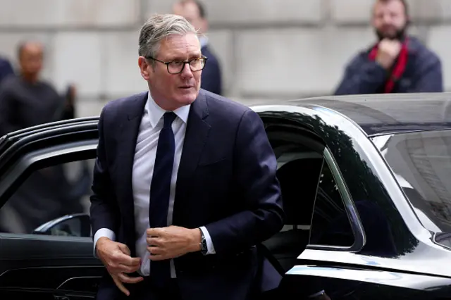 Starmer getting out of a car