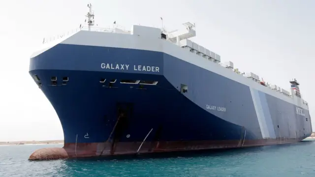 The blue and white bow of the ship called the Galaxy Leader