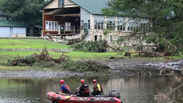 Search and rescue boat inspects a damaged building