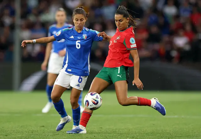Francisca Nazareth of Portugal is challenged by Manuela Giugliano of Italy during the UEFA Women's EURO 2025 Group B match between Portugal and Italy at Stade de Geneve on July 07, 2025 in Geneva, Switzerland.