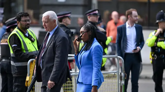 Kemi Badenoch, leader of the Conservative Party, walks outside St Paul's Cathedral in a powder blue skirt suit