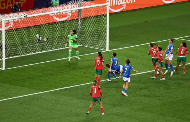 Italy's Cecilia Salvai heads at goal