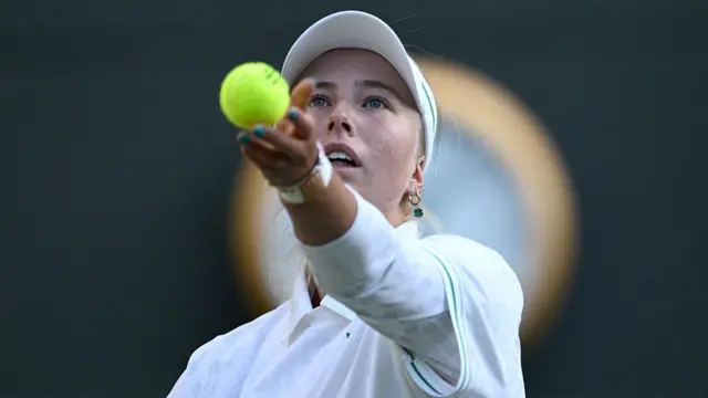 Clara Tauson of Denmark serves
