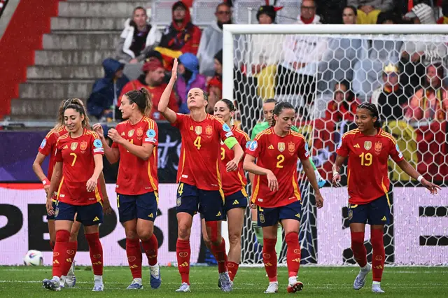 Spain players celebrate after taking the lead against Belgium.