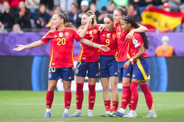 Spain players celebrate after scoring their fifth goal