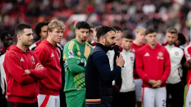 Ruben Amorim giving a speech at Old Trafford in front of the players.