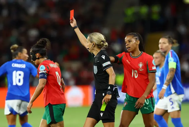 Portugal's Ana Borges is shown a red card by referee Ivana Martincic
