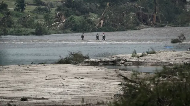 Rescuers search in a flooded area in Kerr County, Texas. Photo: 6 July 2025