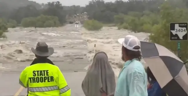 A screengrab from the Texas flooding video showing a road sign which enabled us to geolocate the footage