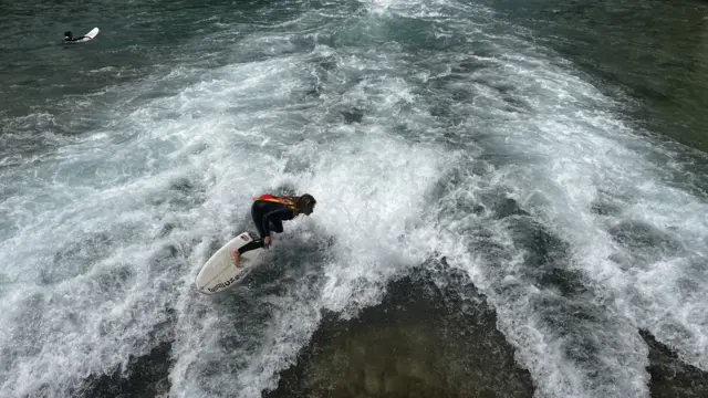 Surfing in Thun river