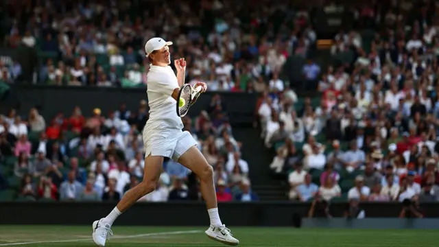 Jannik Sinner plays a forehand return