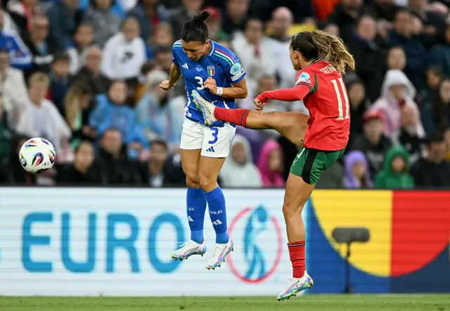 Portugal's midfielder #11 Tatiana Pinto (R) and Italy's defender #03 Lucia Di Guglielmo (L) fight for the ball in the air during the UEFA Women's Euro 2025 Group B football match between Portugal and Italy at the Stade de Geneve in Geneva, on July 7, 2025. (