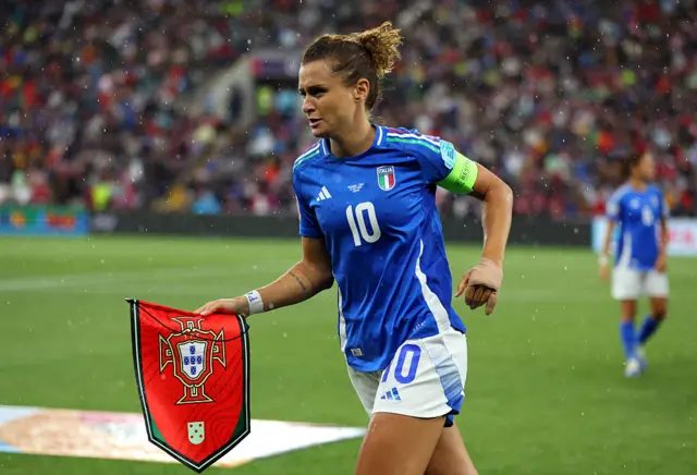 Cristiana Girelli of Italy carries the exchanged match pennant prior to the UEFA Women's EURO 2025 Group B match between Portugal and Italy at Stade de Geneve on July 07, 2025 in Geneva, Switzerland.