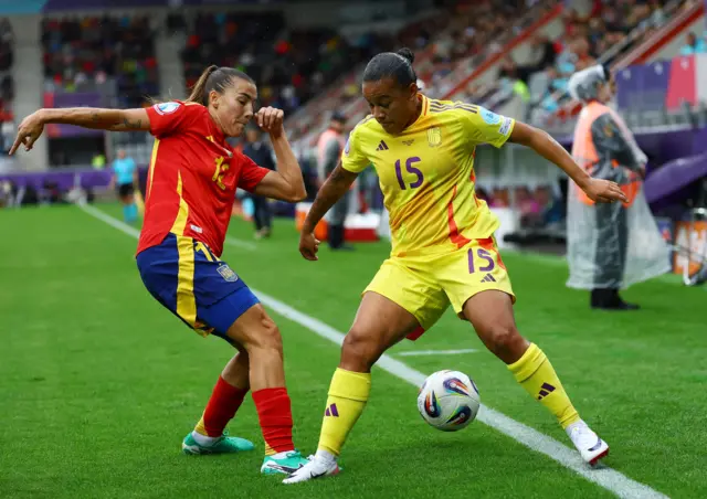 Belgium's Mariam Toloba in action with Spain's Patri Guijarro