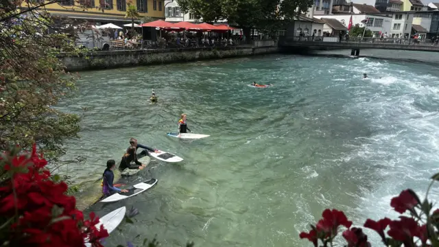 Surfing in Thun river