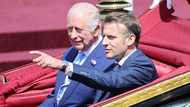 King and Macron in a carriage