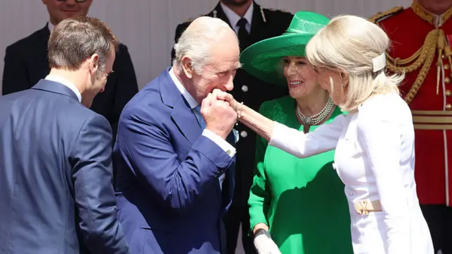 President of France, Emmanuel Macron (L) and Brigitte Macron (R) are received by King Charles III and Queen Camilla at Datchet Road on July 08, 2025 in Windsor