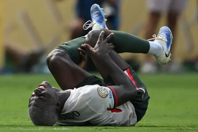 Moises Caicedo goes down with an ankle injury