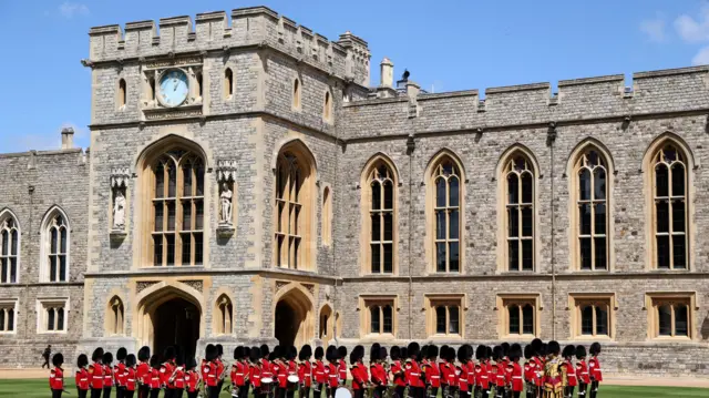 Members of the Scots Guards stand during a ceremonial welcome for the French President and his wife at Windsor Castle, in Windsor west of London, on July 8, 2025