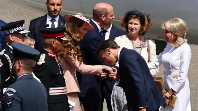 Macron kisses Kates hand while Brigitte shakes William's