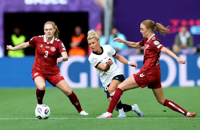 Linda Dallmann of Germany is challenged by Stine Ballisager Pedersen and Sara Holmgaard