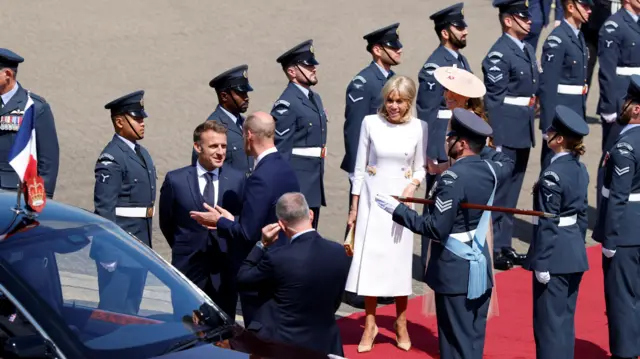 France's President Emmanuel Macron and his wife Brigitte Macron are welcomed by Britain's Prince William, Prince of Wales and Britain's Catherine, Princess of Wales upon arrival at RAF Northolt, in Ruislip, west of London, Britain, on July 8, 2025, on the first day of a three-day state visit to Britain. Geoff