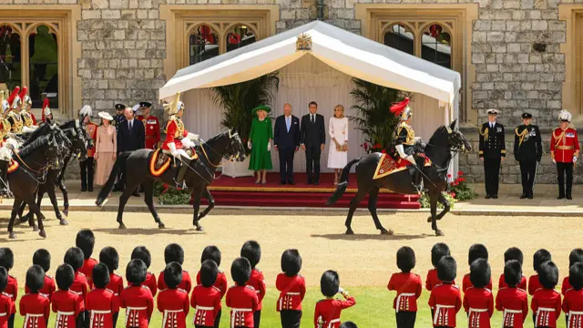 Camilla, Charles, Macron and Brigitte stand during a ceremonial welcome at Windsor Castle.
