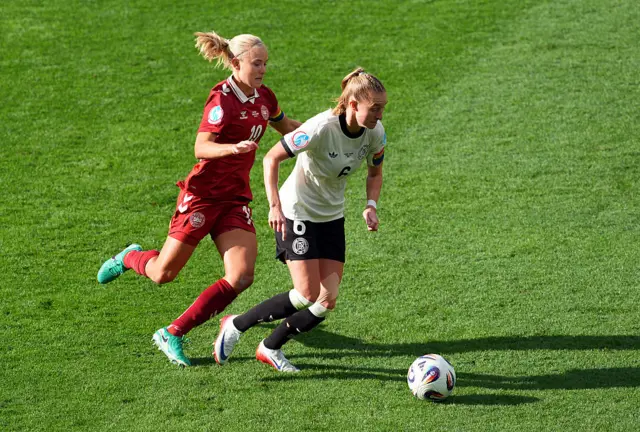 Janina Minge of Germany is challenged by Pernille Harder