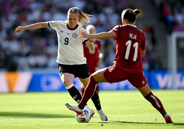 Sjoeke Nuesken of Germany is challenged by Katrine Veje