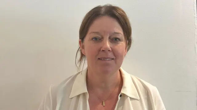 Kathy McAlerney in a white blouse