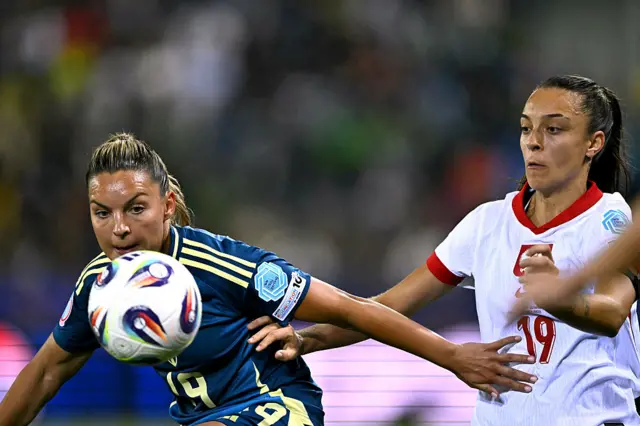 Johanna Rytting Kaneryd (L) and Poland's forward #19 Natalia Padilla Bidas (R) fight for the ball