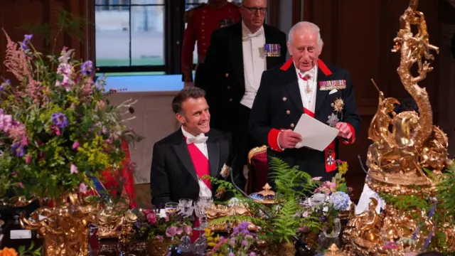 King Charles delivering speech with Macron sitting next to him
