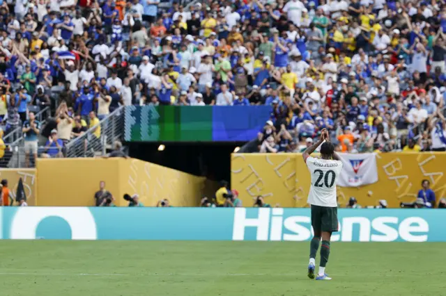 Joao Pedro applauds the Chelsea fans