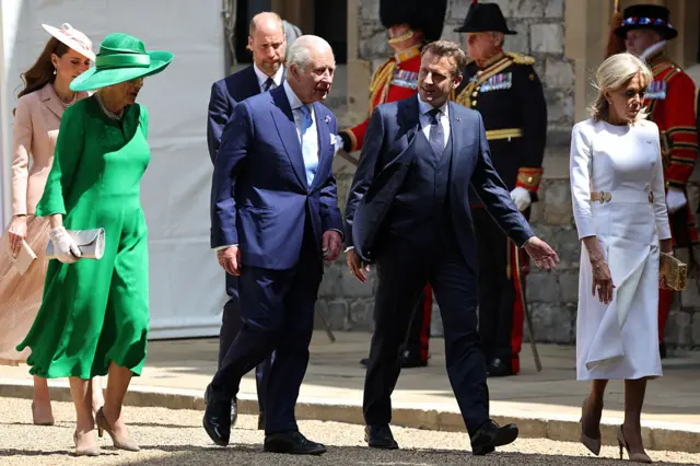 Camilla, Charles, Emmanuel, Brigitte walk in a line followed by Kate and William