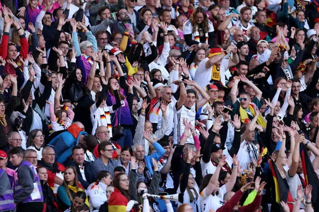 Fans of Germany perform a 'Mexican Wave'