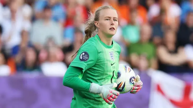Hannah Hampton of England carries the ball