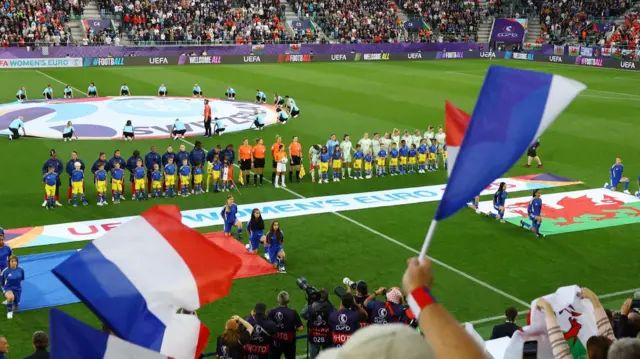 General view as players from both teams line up before the match