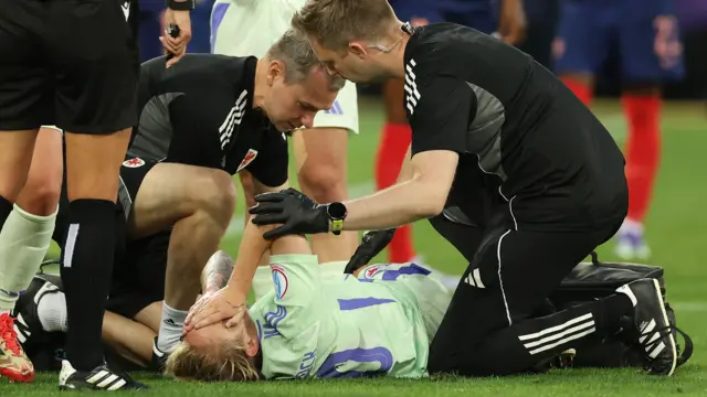 Wales' Jess Fishlock receives treatment