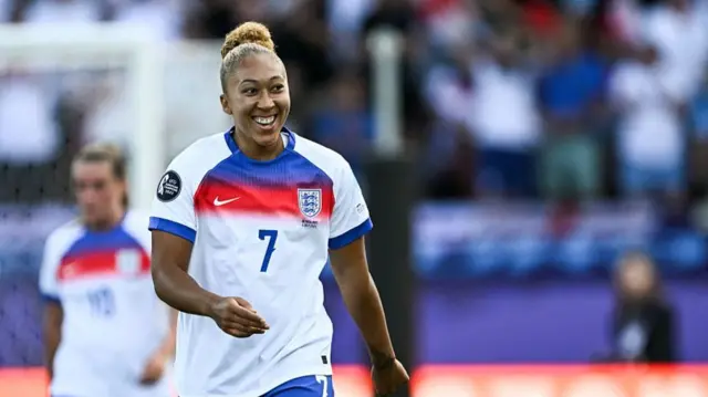 England's forward #07 Lauren James celebrates after scoring the first goal