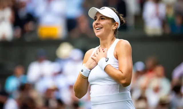 Belinda Bencic puts her hands on her chest