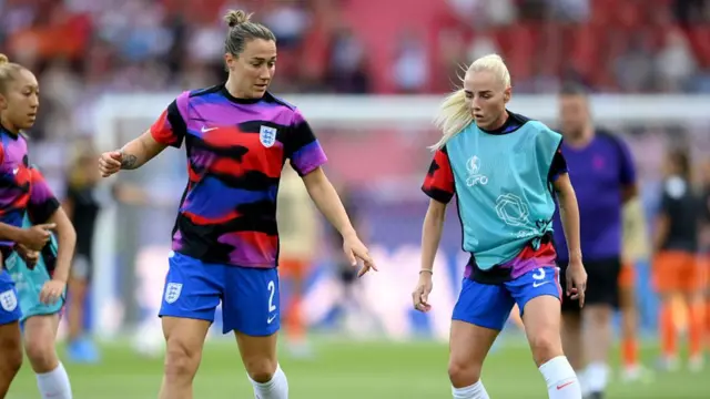 Lucy Bronze and Alex Greenwood of England warm up